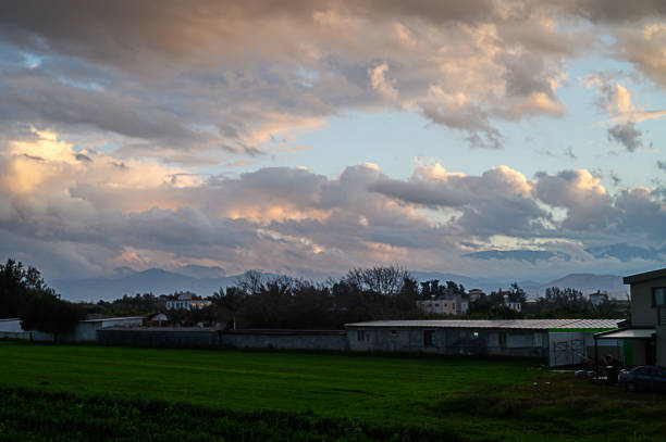 Large plowed field, rural landscape over sky in Sainte-Magnance, France