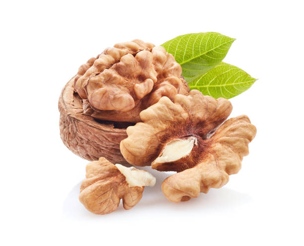 istock Walnuts with leaves in closeup 2195665141