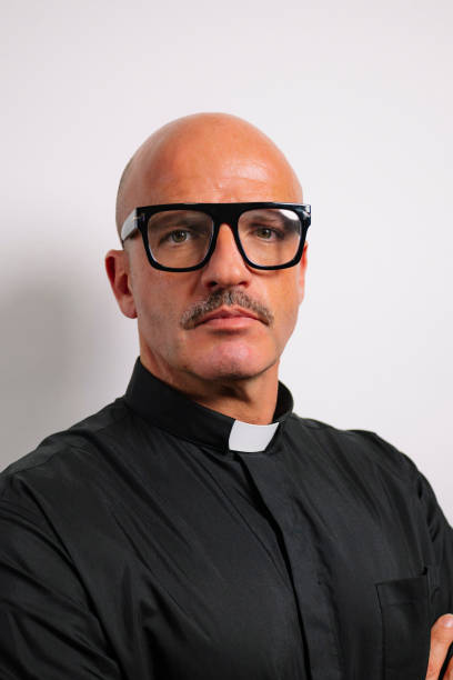 istock Portrait of a priest looking at the camera. 2195666213