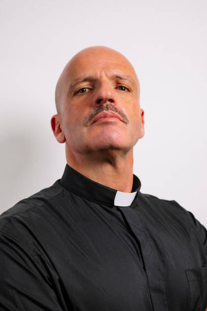 istock Portrait of a priest looking at the camera. 2195666374