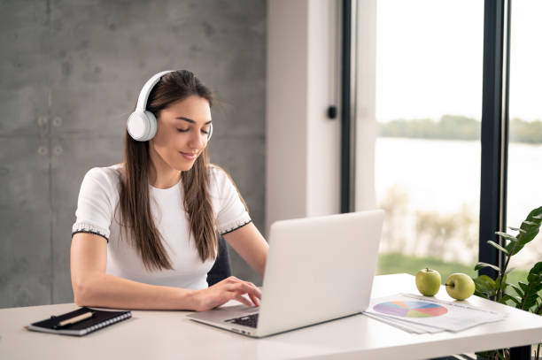 istock Young woman surfing the net 2195669198