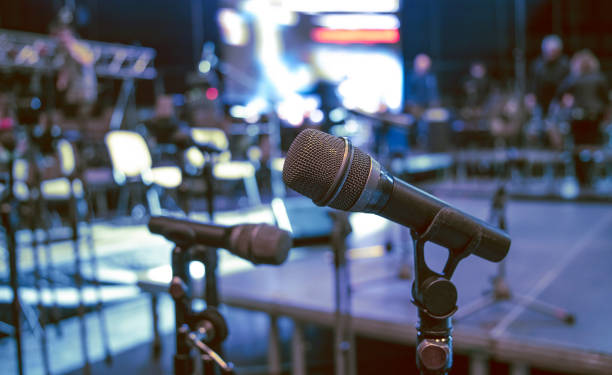 istock two microphones on stage during a rehearsal before a concert. 2195674934
