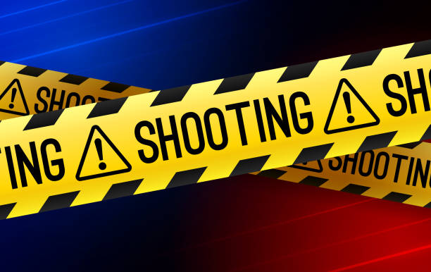 istock Shooting Crime Scene Yellow Do Not Cross Barricade Tape 2195675160