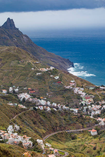 istock village in the mountains on the ocean shore. 2195676575