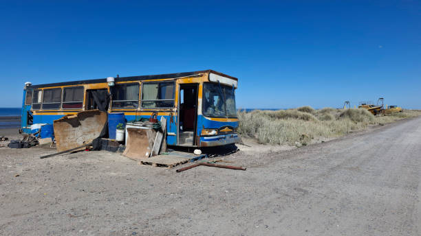 Abandoned bus that serves as a shelter for fishermen at Orengo Beach on the coast of the province of Rio Negro in Argentina