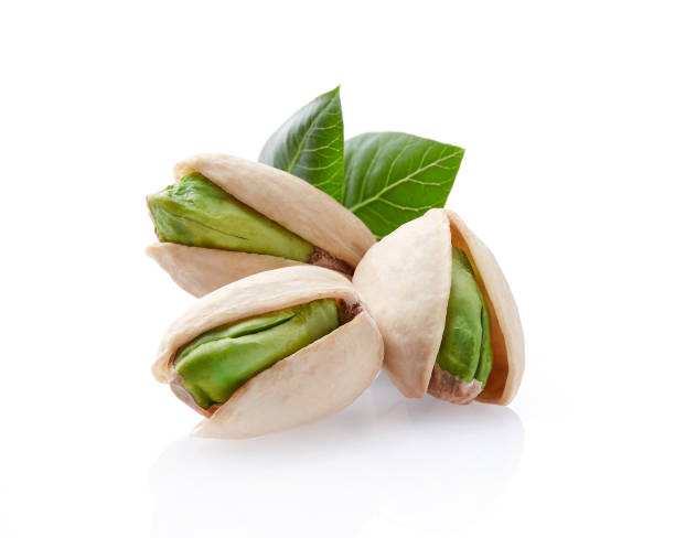 istock Pistachio with leaves on white background 2195677099