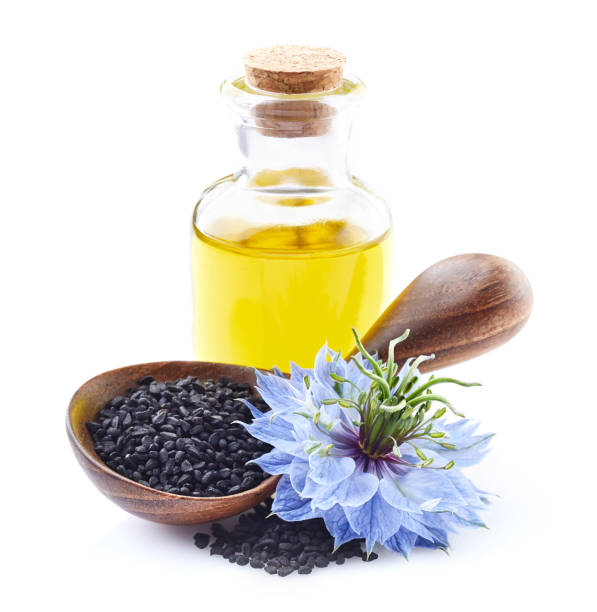 istock Black cumin oil with seeds on white background 2195677126