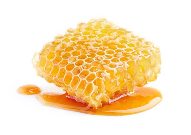 istock Honeycomb with honey on white background 2195677789