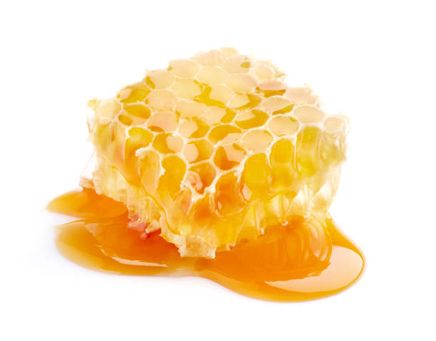 istock Honeycomb with honey on white background 2195677814