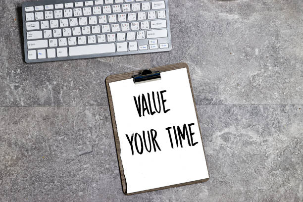 istock Value your time written on clipboard, desktop keyboard 2195680197