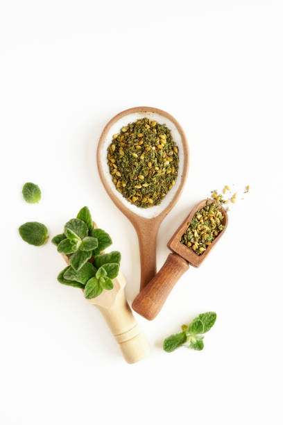 istock Middle Eastern  green zaatar spices i with fresh zaatar leaves . Top view with copy space 2195681087