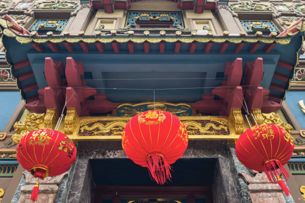 istock Red Chinese lanterns on a Chinese style porch. 2195681728