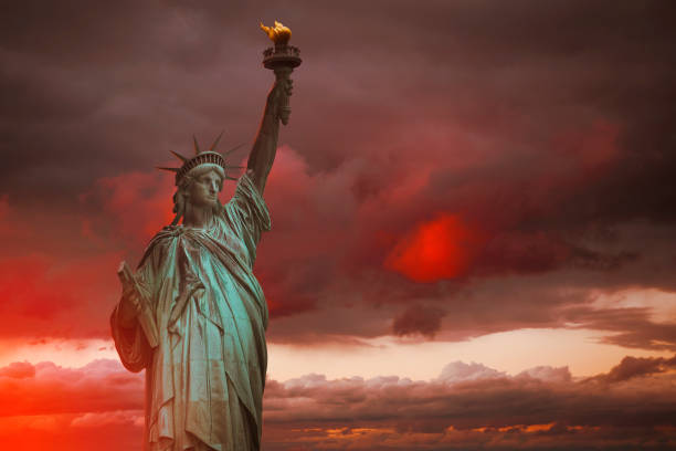 Statue of Liberty against dramatic sky. New York. USA