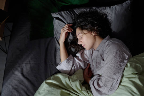 istock Woman Enjoying Sleeping in New Bed 2195685276