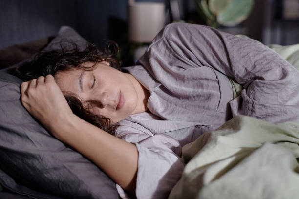 istock Woman Napping in Bed Peacefully 2195685306