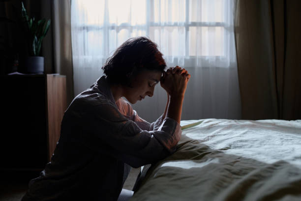 istock Woman Praying in Morning 2195687501