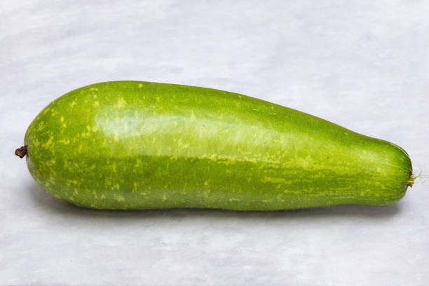 istock A fresh bottle gourd (Lagenaria siceraria), also known as Calabash, isolated on a white background. 2195688965