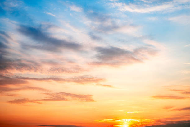 istock Sky,sunset, beautiful , luxury soft gradient orange gold clouds and sunlight on the blue sky perfect for the background, Sunrise on morning or everning in winter warm time ,Twilight summer,silhouette 2195689809