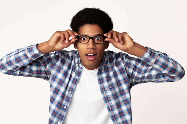 istock Surprised african-american student touching glasses feeling shocked 2195690568