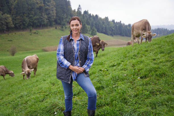 istock Female farmer portrait on pasture 2195695087
