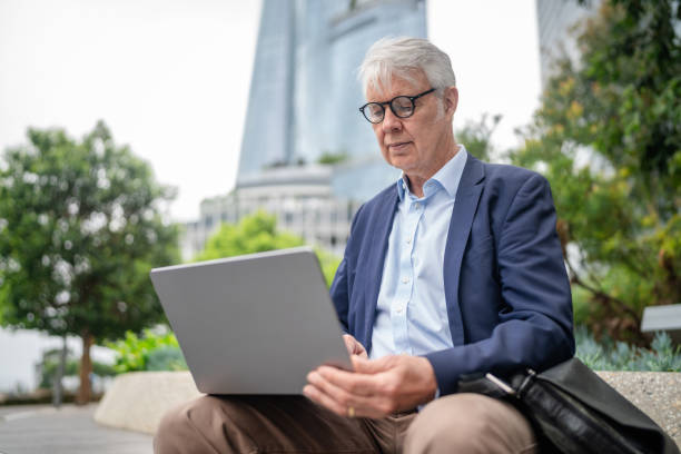 istock Business professional focused on work outdoors in Sydney's bustling corporate environment 2195695171