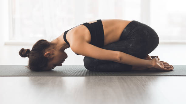 istock Practicing Yoga in a Serene Indoor Space During Early Morning Hours 2195695354