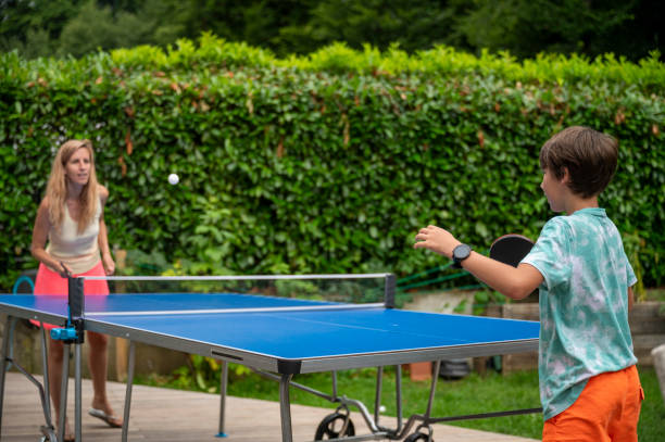 istock Mother and son playing table tennis 2195695663
