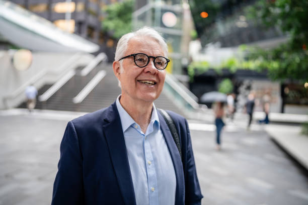 istock Business professional smiling confidently while walking through bustling Sydney city streets 2195695678