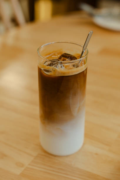 istock Iced coffee in a tall glass on a table 2195697887