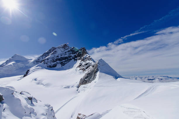 istock Majestic snow-capped peaks under a bright sun 2195698507