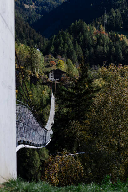 istock Suspension bridge in mountain valley 2195698582
