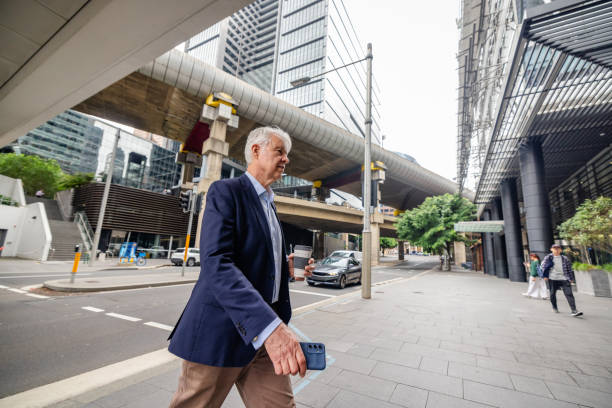 istock Busy professionals navigating the streets of Sydney with confidence during a workday 2195699313