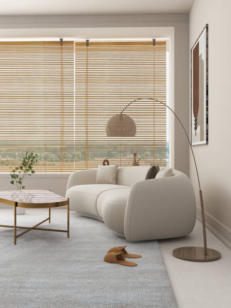 istock A modern living room decor concept with warm and romantic color features a beige curved sofa, a wooden coffee table with a marble top, and a woven floor lamp. 2195700969