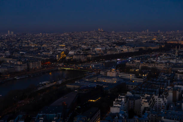 Paris city at night, France. Sunset and colorful sky. View from Eiffel Tower top. High quality photo