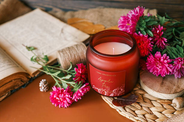 istock Candle and aster flowers in autumn interior 2195702642