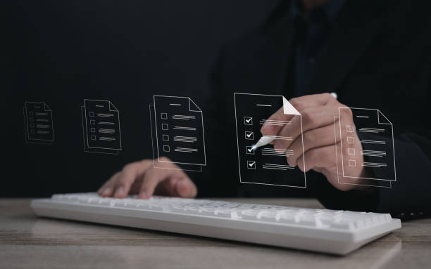 istock Performance checklist concept : businessman using stylus pen with laptop for questionnaire, evaluation, assessment online or survey exam and filling out for digital survey and checklist. 2195704125