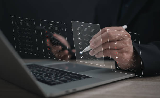 istock Performance checklist concept : businessman using stylus pen with laptop for questionnaire, evaluation, assessment online or survey exam and filling out for digital survey and checklist. 2195704278
