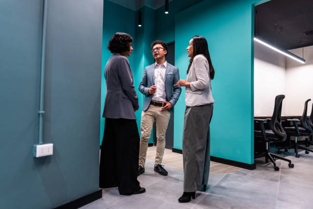 istock Coworkers talking on the office 2195707924