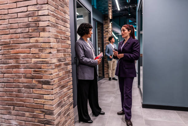 istock Coworkers talking on the office 2195708613
