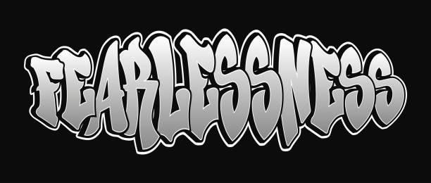 istock Bold urban art depicting the word Fearlessness in striking silver graffiti on a black background 2195710717