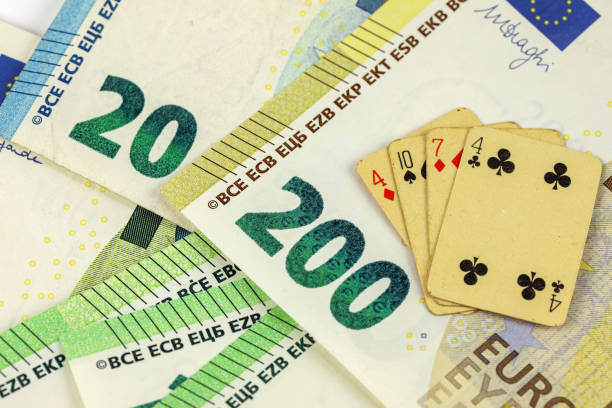 Playing cards and European Union banknotes. This theme can represent a wide range of gaming and financial themes.