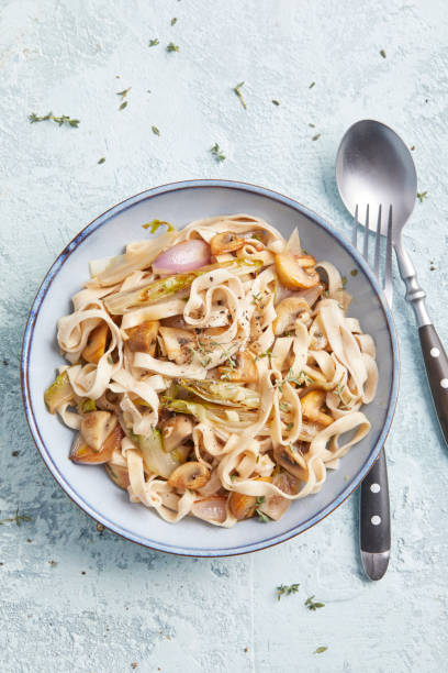 istock Pasta with Mushrooms and Chicory 2195711882