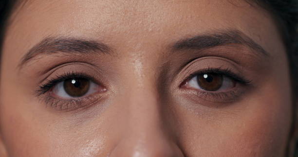 istock Simple video featuring a girl making direct eye contact, blinking, and expressing happiness with laughter in a charming portrait 2195713948