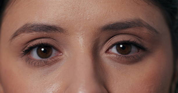istock Simple video featuring a girl making direct eye contact, blinking, and expressing happiness with laughter in a charming portrait 2195713977
