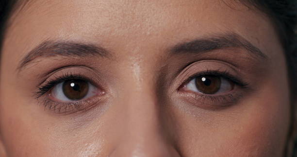 istock Simple video featuring a girl making direct eye contact, blinking, and expressing happiness with laughter in a charming portrait 2195713985