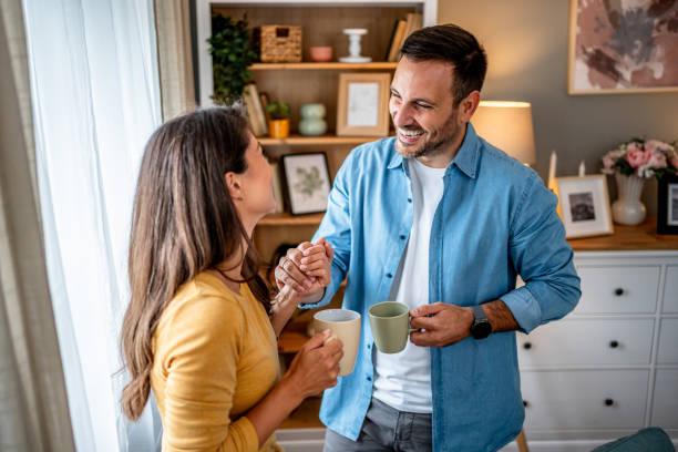 istock Couple drinking coffee together at home 2195717026
