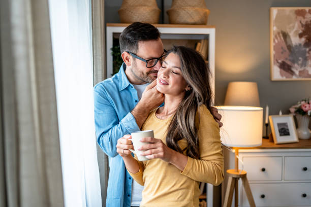 istock Couple relaxing together at home 2195717473