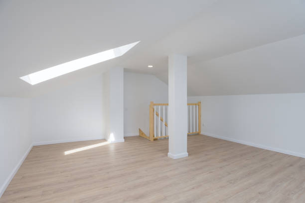 istock Empty Attic Room with Skylight and Wooden Stairs 2195719527