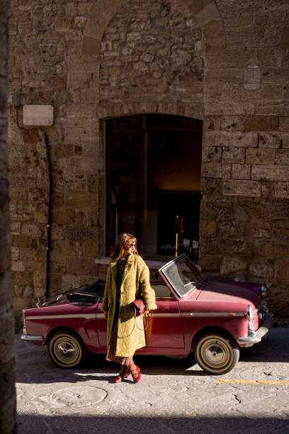istock Woman and Vintage Convertible 2195719642