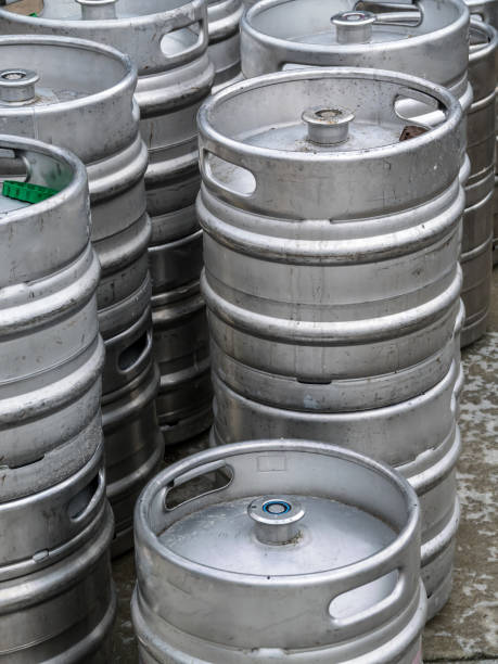 istock Stacked Steel Beer Kegs in a Storage Area 2195719943